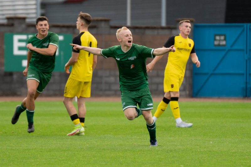 James Russell celebrates opening the scoring.